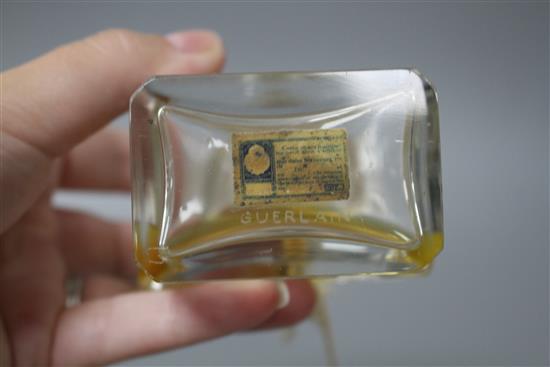 A Coty glass perfume bottle with frosted stopper, height 12cm, and a Guerlain Mitsouko perfume bottle, height 12cm